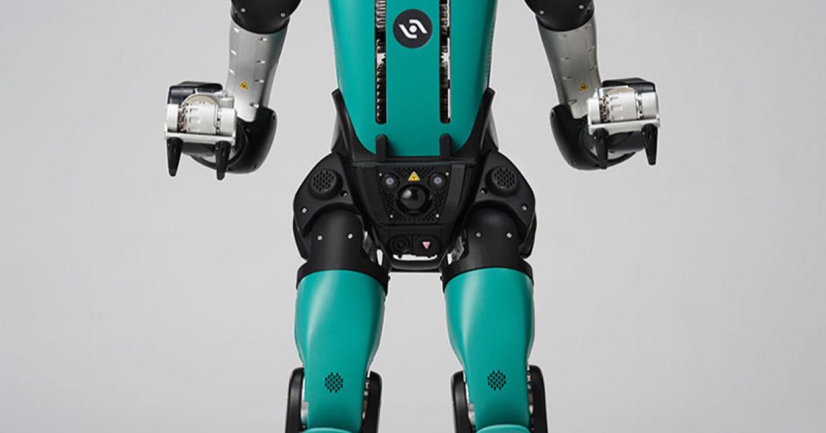 Full-body studio product photo of the Digit 5 humanoid robot by Agility Robotics, teal and black with a chest display reading 1024 AUTO