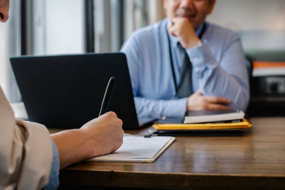 Job interview setting with employer and candidate, representing rehiring
