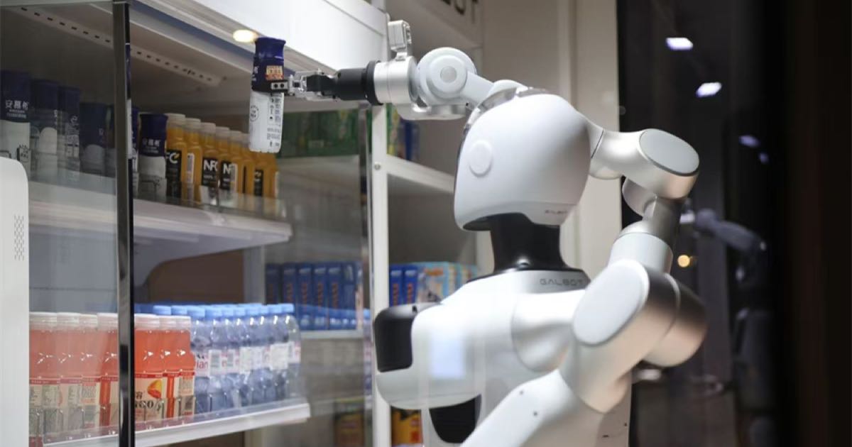 A Galbot humanoid robot selling snacks from a smart retail pod in Zhengzhou, China.