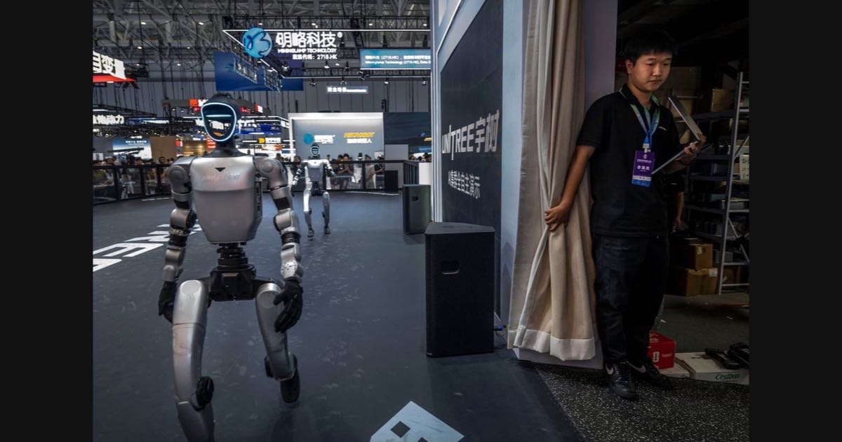 Unitree humanoid robots performing in formation at the 2026 World Robot Conference in Beijing.