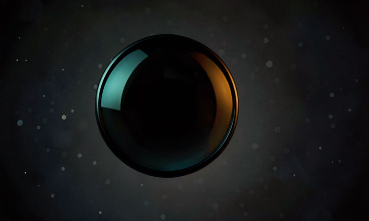 An abstract composition showing a dark optical lens element reflecting amber and teal light, suggesting machine vision emerging from shadow