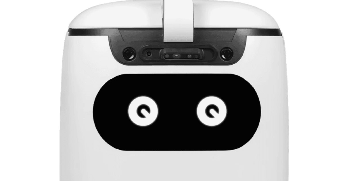 Close-up of the TOMO education robot, a white wheel-based humanoid with a black face screen showing two glowing eyes.