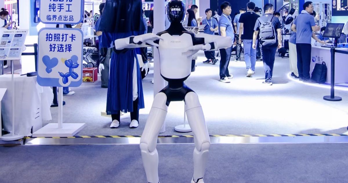 Rows of humanoid robots on a factory production line in China.
