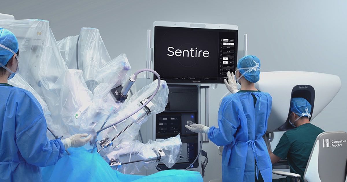 Surgeons operating the Cornerstone Robotics Sentire surgical system in an operating theatre