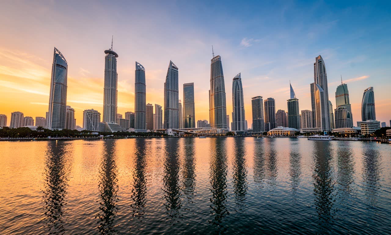 A modern Singapore skyscraper skyline at sunset, Marina Bay Sands in background, warm golden lighting, architectural photography
