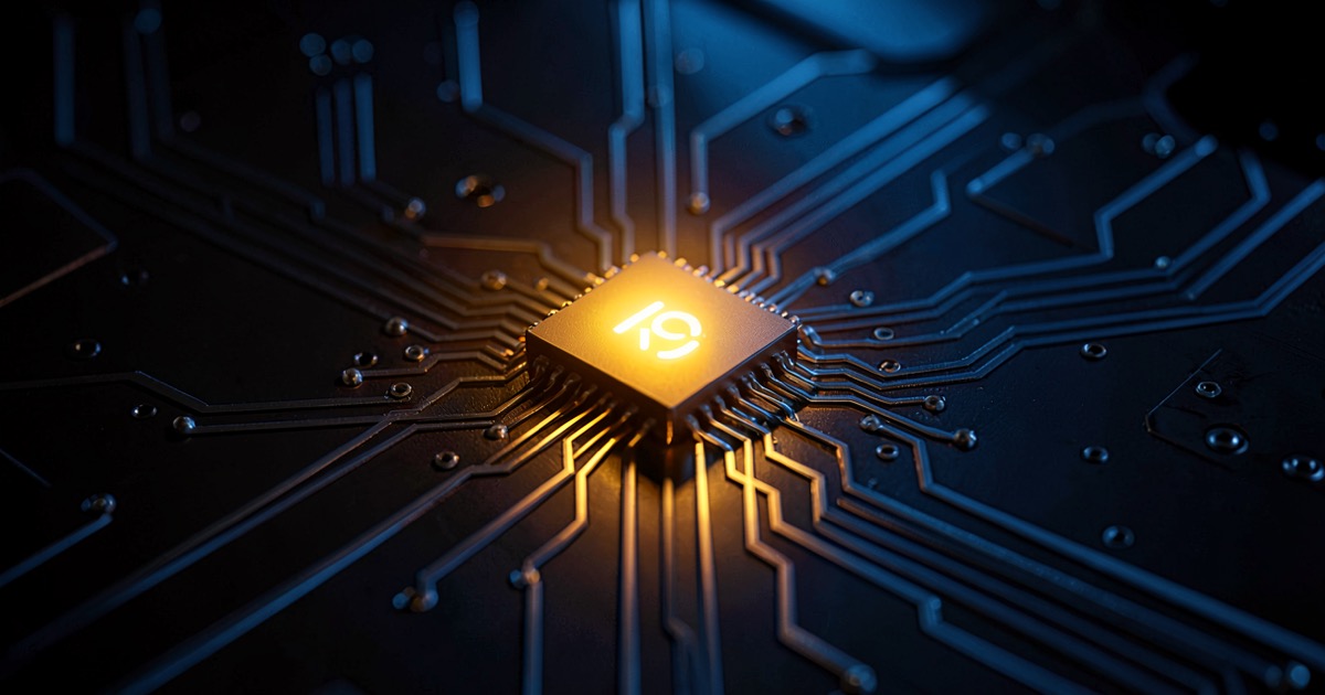 A small glowing AI chip on a laptop motherboard with warm amber light against deep blue circuit traces