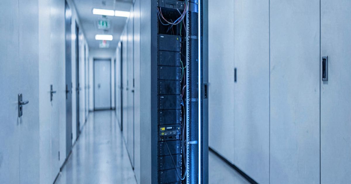 A minimalist server rack in a clean data centre corridor, cool blue lighting, representing efficient AI model architecture.
