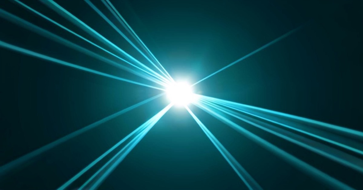 Abstract composition of parallel light streams converging into a glowing core against a dark background, representing high-speed AI model inference.
