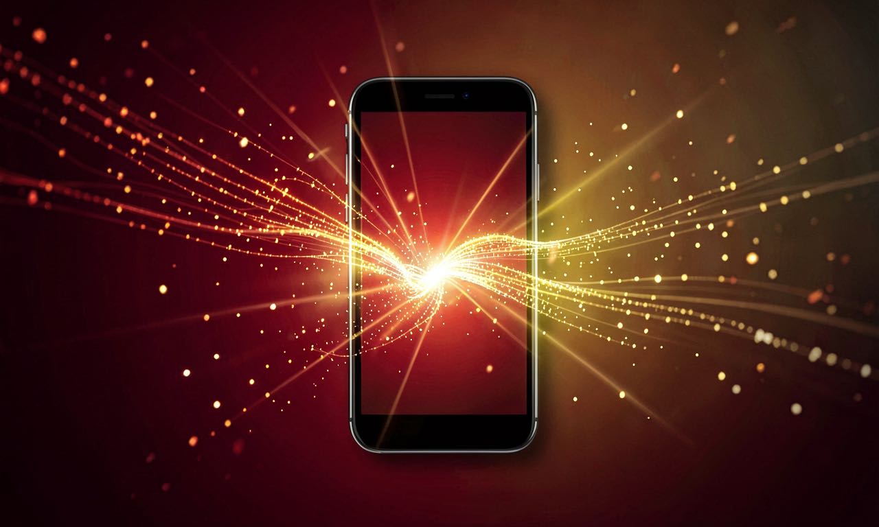 Abstract composition of glowing data streams converging into a single smartphone silhouette against a deep red and gold gradient background