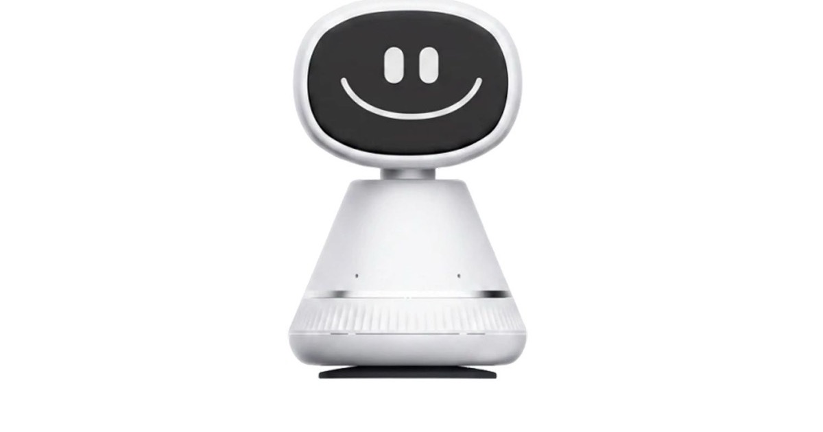 The Timo in-car AI social robot, a white cone-shaped dashboard device with a dark OLED face showing a simple smile, photographed against a plain white background