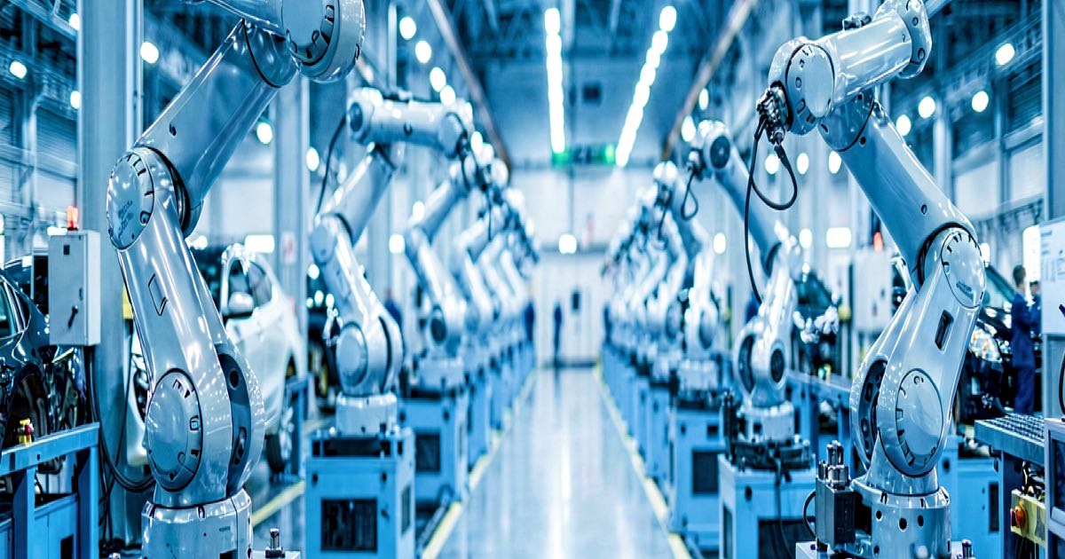 A modern automotive assembly line with robotic arms and a humanoid robot silhouette in the background, photographed in cool industrial lighting.